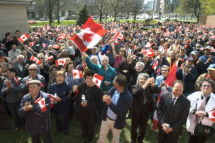 Portuguese workers rally at Queen's Park to protest deportations of undocumented workers